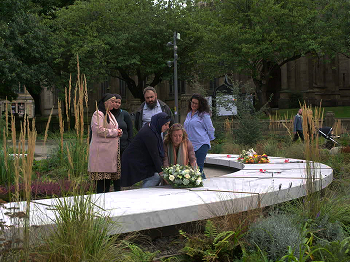 People visiting the Manchester Memorial
