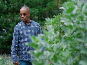 Grenfell representative walking round a garden
