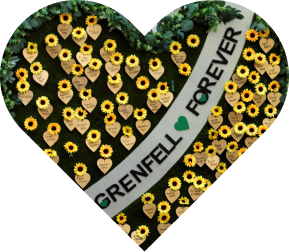Flower wreath in the shape of a heart with 'grenfell forever' written on it